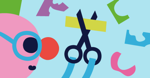 Bibliotekets maskot pysslar med sax och pappersremsor